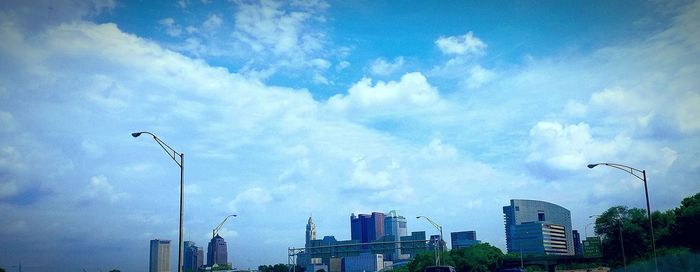 Low angle view of building against cloudy sky