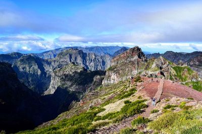 Panoramic view of mountains against blue sky