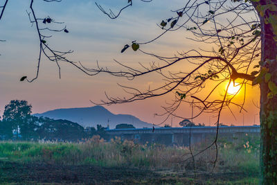 Scenic view of land against sky during sunset