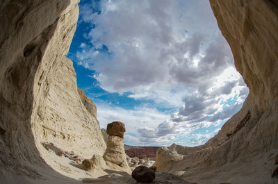 Low angle view of rock formations against sky