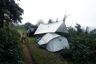 Tent on field against sky