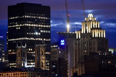 Illuminated buildings in city at night