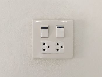 Close-up of light switch on wall