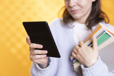 Young woman using digital tablet