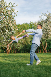 Full length of man playing soccer on field