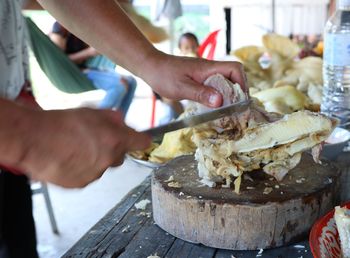 Midsection of man preparing food