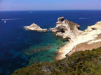 Scenic view of sea against blue sky