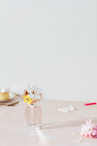 Perfume bottle, cupcake, candles, flower