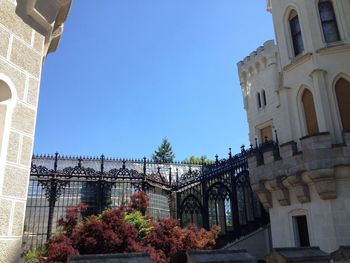 Low angle view of building against clear blue sky