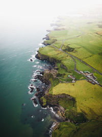 Aerial view of landscape by sea