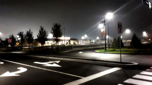 View of illuminated street at night