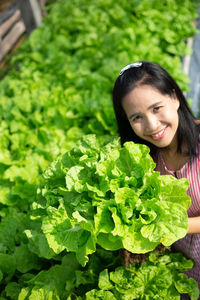 Portrait of smiling woman with vegetables