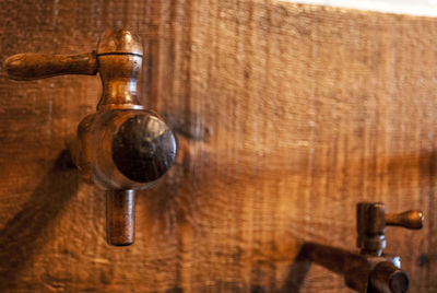 Close-up of metallic objects on wood
