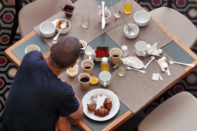 High angle view of person sitting in restaurant