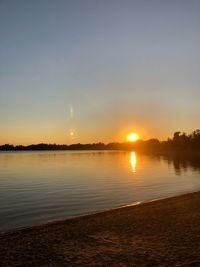 Scenic view of sunset over lake