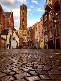 View of street amidst buildings in town