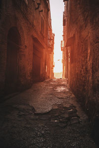 Alley amidst buildings in city