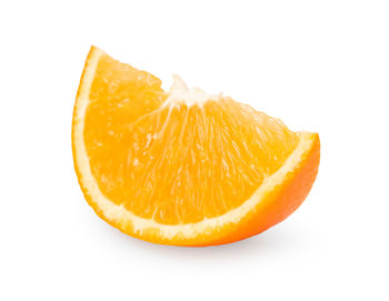 Close-up of orange slice against white background