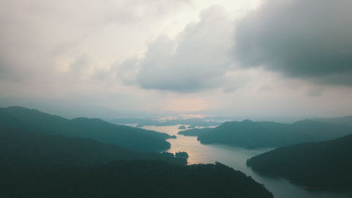 Scenic view of silhouette mountains against sky