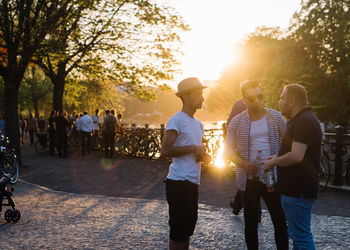 Group of people at park during sunset