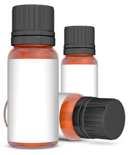 Essential oil in bottles on white background