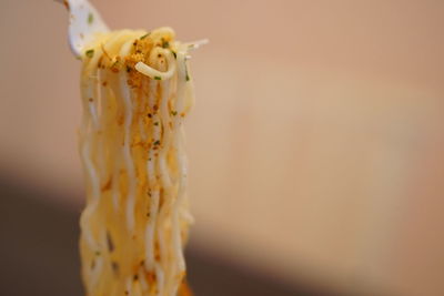 Close-up of ice cream hanging on wood