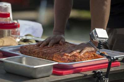 Mid section of a man preparing food