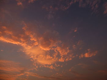 Low angle view of dramatic sky during sunset