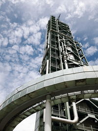 Low angle view of building against cloudy sky