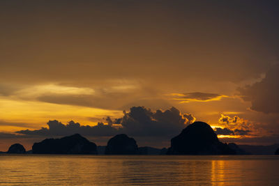 Scenic view of sea against romantic sky at sunset