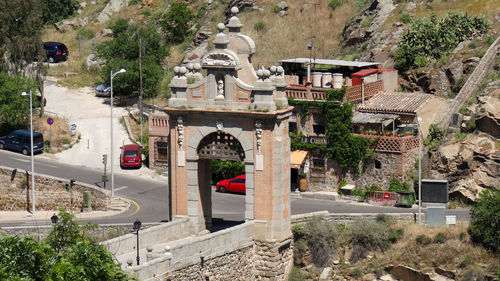 High angle view of road by buildings in city