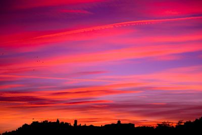 Silhouette of buildings at sunset