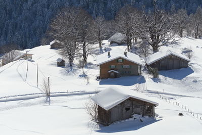 House on snow covered field