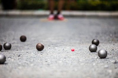 Close-up of bocce ball on street