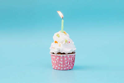 Close-up of ice cream against blue background