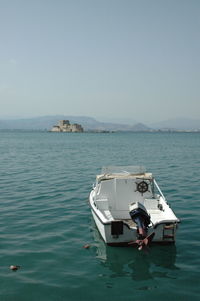 Ship in sea against clear sky