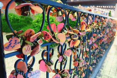 Close-up of padlocks on railing