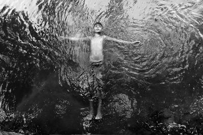 High angle view of man swimming in sea