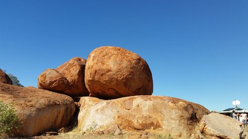 Rock formation against clear blue sky