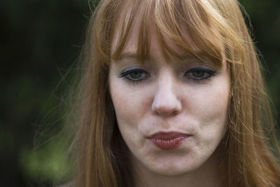 Close-up of young woman looking away