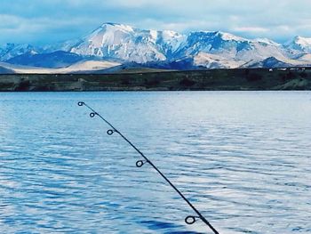 Scenic view of lake with mountains in background