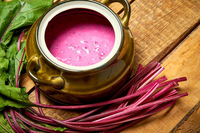 High angle view of pink tea on table