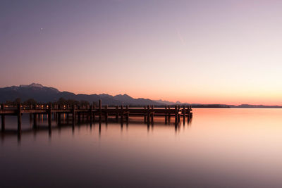 Scenic view of sea against clear sky during sunset