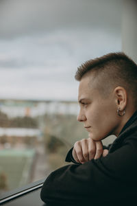 Portrait of young man looking away