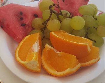 High angle view of orange slices in plate on table