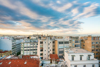 Aerial view of townscape against sky during sunset