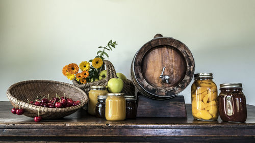 Various fruits in basket on table