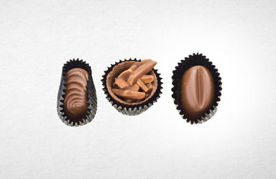 Close-up of cupcakes against white background