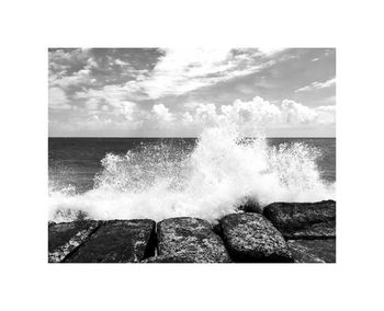 Waves breaking against sea