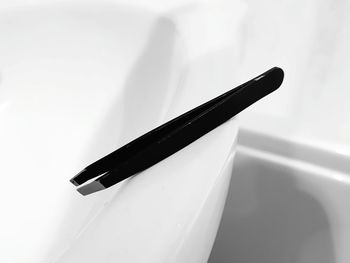 Close-up of pen on table